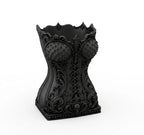 Zwarte make-upkwastenhouder in de vorm van een gothic corset